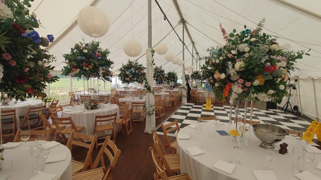 Previous weddings in marquees using bright bold colours for impact on a white background