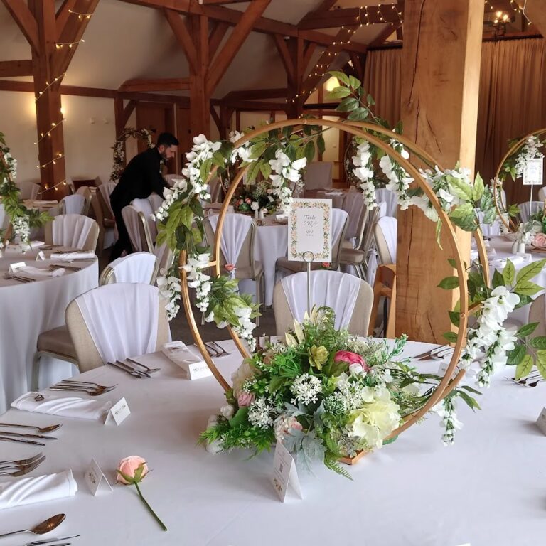 Gold hoop centrepiece creations with floral additions