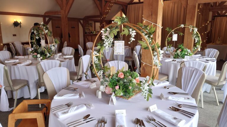 Wedding table centrepieces at Sandhole Oak Barn